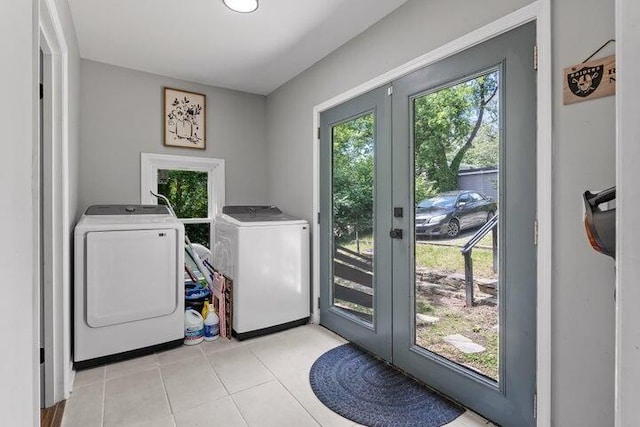 3474 Lockwood Cir, Chattanooga, TN 37415 - laundry room with washing machine and dryer, french doors, and light tile patterned flooring