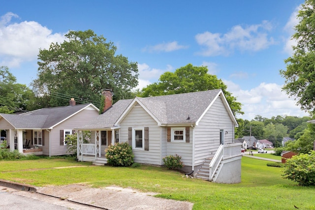 1803 Dimple Ct, Columbia, TN 38401 - ranch-style house featuring a front lawn, a chimney, and roof with shingles