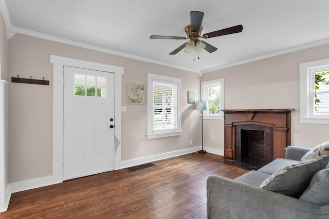 1803 Dimple Ct, Columbia, TN 38401 - living room featuring dark wood-style floors, plenty of natural light, ornamental molding, and a fireplace with flush hearth