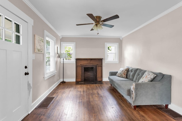 1803 Dimple Ct, Columbia, TN 38401 - living area featuring dark wood-style floors, a fireplace, ceiling fan, and ornamental molding