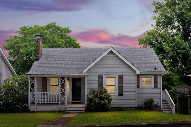 1803 Dimple Ct, Columbia, TN 38401 - view of front facade with covered porch, a shingled roof, a front lawn, stairway, and a chimney