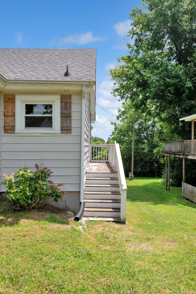 1803 Dimple Ct, Columbia, TN 38401 - view of side of property featuring a shingled roof, a lawn, and stairway