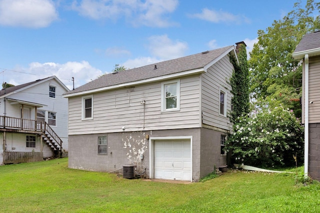 1803 Dimple Ct, Columbia, TN 38401 - rear view of property featuring a chimney, a yard, an attached garage, and roof with shingles