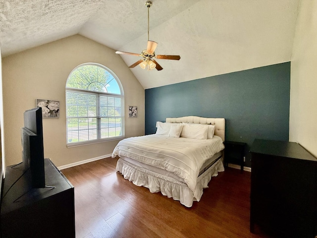 1252 Azure Way, Murfreesboro, TN 37128 - bedroom featuring dark wood-style floors, lofted ceiling, ceiling fan, and a textured ceiling