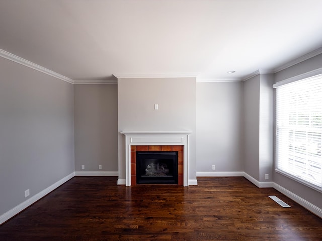 527 32nd Ave S, Nashville, TN 37212 - unfurnished living room with plenty of natural light, ornamental molding, wood finished floors, and a tile fireplace