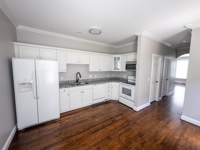 527 32nd Ave S, Nashville, TN 37212 - kitchen with white appliances, light stone countertops, ornamental molding, white cabinets, and dark wood-style flooring