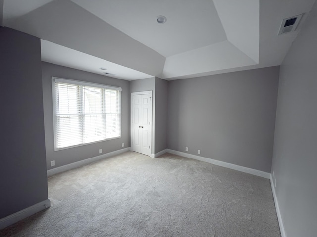 527 32nd Ave S, Nashville, TN 37212 - unfurnished bedroom with light colored carpet, a closet, and a raised ceiling