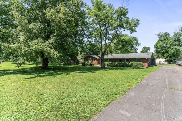 1006 Houston Dr, Murfreesboro, TN 37130 - ranch-style home with a front yard and brick siding