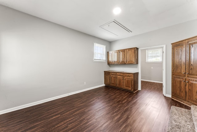 1006 Houston Dr, Murfreesboro, TN 37130 - kitchen featuring brown cabinets, dark wood-style floors, healthy amount of natural light, and light countertops
