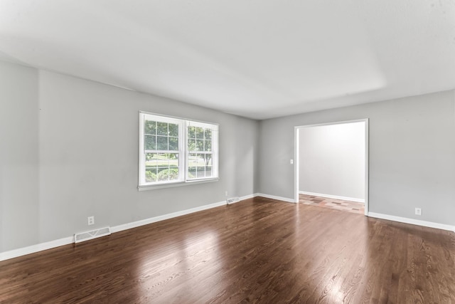 1006 Houston Dr, Murfreesboro, TN 37130 - empty room featuring dark wood-type flooring and baseboards