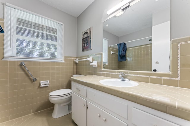 1006 Houston Dr, Murfreesboro, TN 37130 - full bathroom with tiled shower, vanity, tile patterned floors, tile walls, and wainscoting