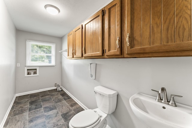 1006 Houston Dr, Murfreesboro, TN 37130 - bathroom featuring a sink and stone finish flooring