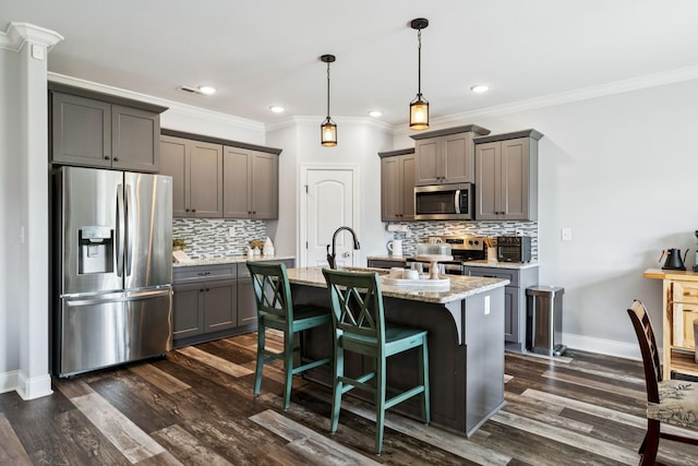 5123 Vinnie Dell Dr, Chapel Hill, TN 37034 - kitchen featuring appliances with stainless steel finishes, gray cabinets, decorative backsplash, a kitchen island with sink, and recessed lighting