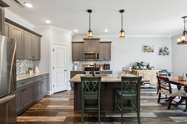 5123 Vinnie Dell Dr, Chapel Hill, TN 37034 - kitchen with appliances with stainless steel finishes, tasteful backsplash, dark wood-style floors, light stone counters, and crown molding