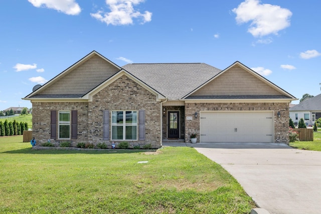 5123 Vinnie Dell Dr, Chapel Hill, TN 37034 - craftsman inspired home with an attached garage, concrete driveway, a front yard, and brick siding