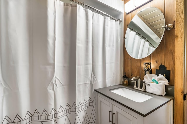 1530 Zurich Rd, Gatlinburg, TN 37738 - bathroom with vanity, wood walls, and curtained shower