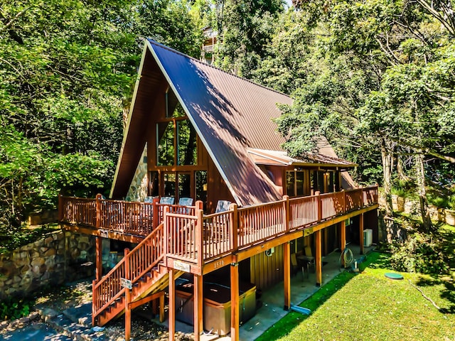 1530 Zurich Rd, Gatlinburg, TN 37738 - back of house with a wooden deck, a lawn, a metal roof, and stairway