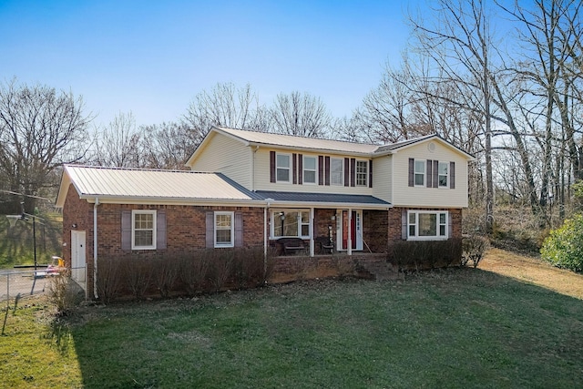783 W Main St, Mcminnville, TN 37110 - traditional-style house with brick siding, a metal roof, and a porch