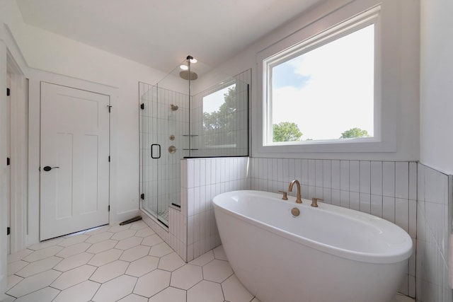 19 Peyton Pl, Columbia, TN 38401 - full bath with a stall shower, a freestanding bath, tile walls, and tile patterned flooring