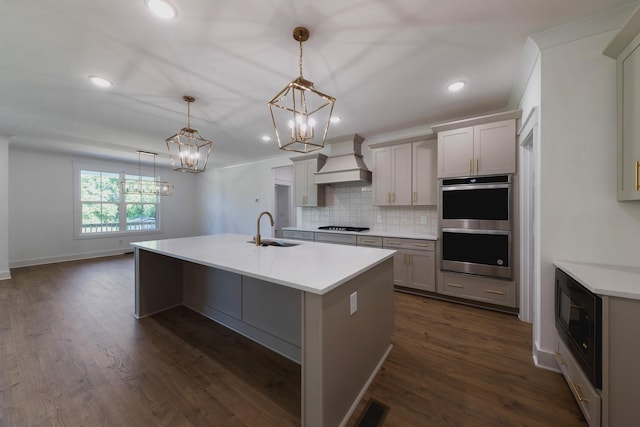 19 Peyton Pl, Columbia, TN 38401 - kitchen with custom range hood, a chandelier, black appliances, tasteful backsplash, and light countertops