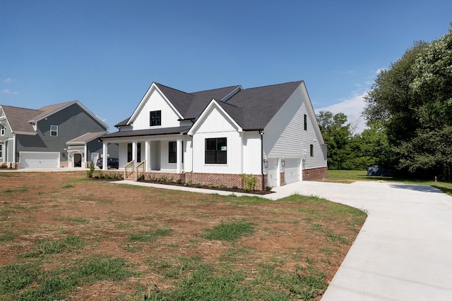 19 Peyton Pl, Columbia, TN 38401 - modern farmhouse style home featuring an attached garage, a porch, board and batten siding, concrete driveway, and a front yard