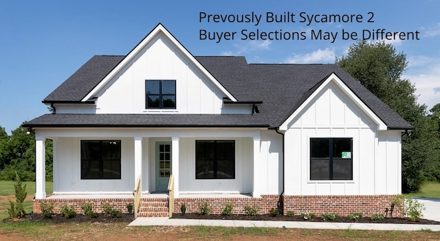 19 Peyton Pl, Columbia, TN 38401 - view of front of house featuring board and batten siding, a porch, roof with shingles, and brick siding