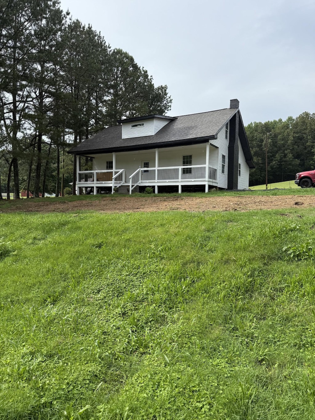 975 Witcher Hollow Rd, Red Boiling Springs, TN 37150 - view of front of home with a front yard, a chimney, and a porch