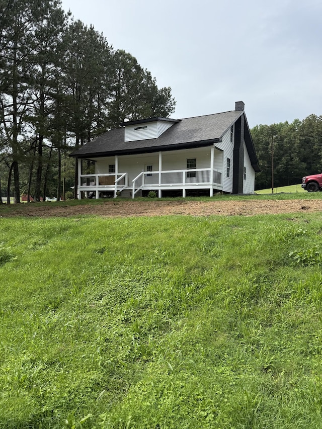 975 Witcher Hollow Rd, Red Boiling Springs, TN 37150 - view of front of home with a front yard, a chimney, and a porch