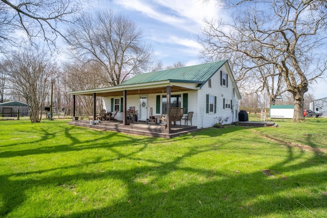 135 Campbellsville Pike, Ethridge, TN 38456 - back of property featuring a yard, a metal roof, and covered porch