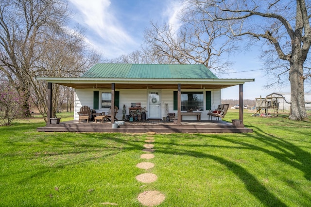135 Campbellsville Pike, Ethridge, TN 38456 - back of property featuring a metal roof and a yard