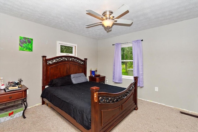 135 Campbellsville Pike, Ethridge, TN 38456 - bedroom with light carpet, a ceiling fan, and a textured ceiling