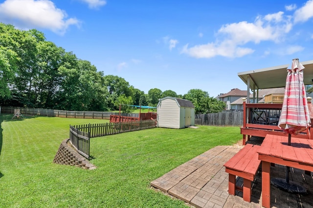 1386 Bruceton Dr, Clarksville, TN 37042 - fenced backyard with a shed, a wooden deck, and a patio area