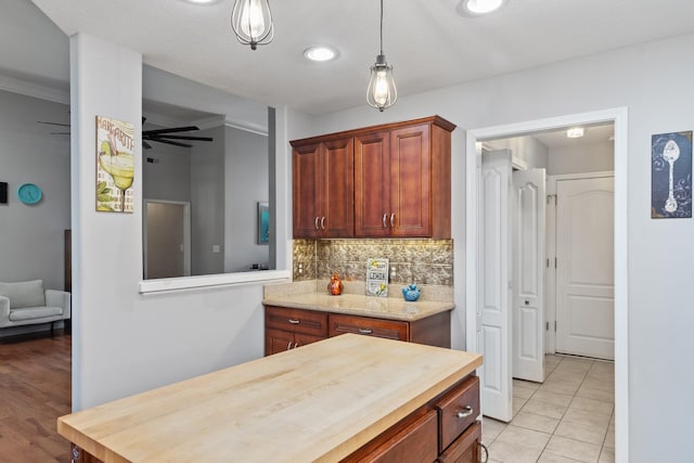 1386 Bruceton Dr, Clarksville, TN 37042 - kitchen with wood counters, backsplash, light tile patterned flooring, and pendant lighting