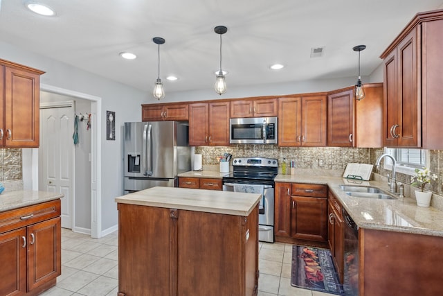 1386 Bruceton Dr, Clarksville, TN 37042 - kitchen featuring appliances with stainless steel finishes, light tile patterned flooring, tasteful backsplash, decorative light fixtures, and recessed lighting
