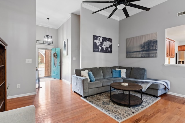 1386 Bruceton Dr, Clarksville, TN 37042 - living area with a ceiling fan, crown molding, light wood-style flooring, a chandelier, and a high ceiling