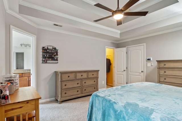 1386 Bruceton Dr, Clarksville, TN 37042 - bedroom with a tray ceiling, light carpet, ornamental molding, connected bathroom, and ceiling fan