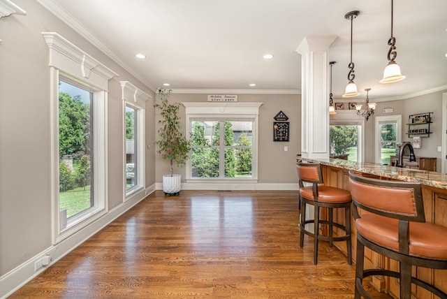 517 Burnett Rd, Mount Juliet, TN 37122 - kitchen with healthy amount of natural light, light stone countertops, wood finished floors, hanging light fixtures, and recessed lighting
