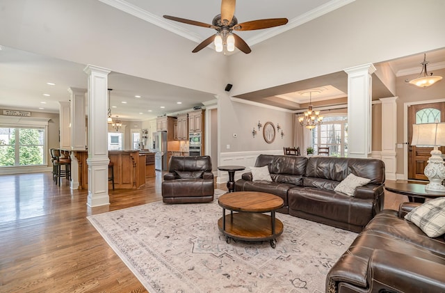 517 Burnett Rd, Mount Juliet, TN 37122 - living room with ornamental molding, a decorative wall, light wood-style floors, ornate columns, and ceiling fan
