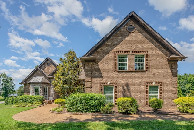 517 Burnett Rd, Mount Juliet, TN 37122 - view of front of home featuring brick siding, a standing seam roof, and a metal roof