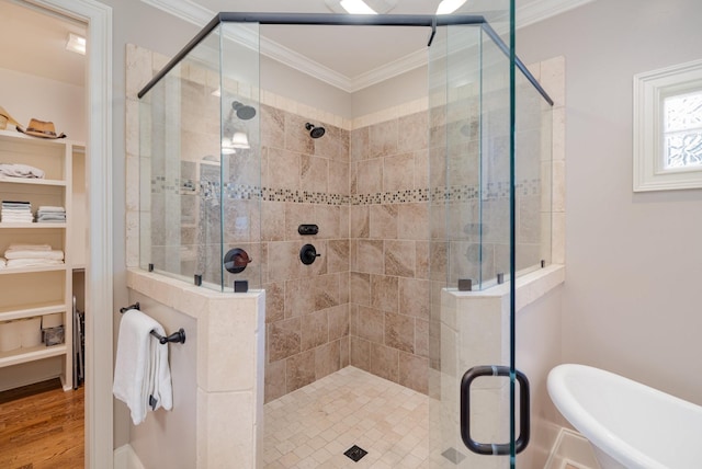 517 Burnett Rd, Mount Juliet, TN 37122 - full bath featuring a walk in closet, ornamental molding, a stall shower, a freestanding tub, and wood finished floors