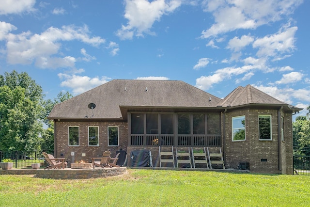 517 Burnett Rd, Mount Juliet, TN 37122 - back of property with a fire pit, a sunroom, a patio, brick siding, and roof with shingles