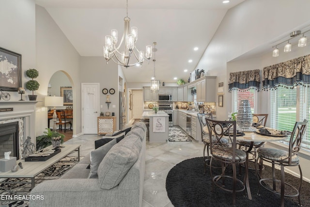 187 Forest View Dr, Crossville, TN 38558 - living area featuring high vaulted ceiling, arched walkways, recessed lighting, a chandelier, and a fireplace