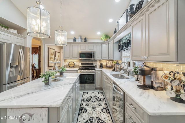 187 Forest View Dr, Crossville, TN 38558 - kitchen featuring appliances with stainless steel finishes, backsplash, a kitchen island, light stone counters, and recessed lighting