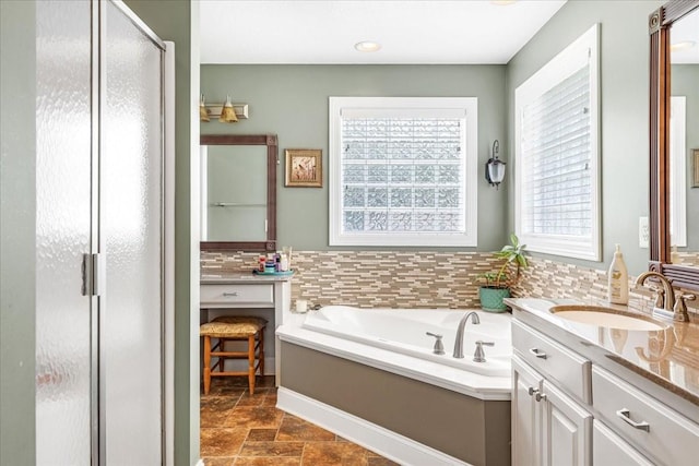 379 Hooper Rd, Winchester, TN 37398 - full bath with a stall shower, vanity, a garden tub, and stone finish floors