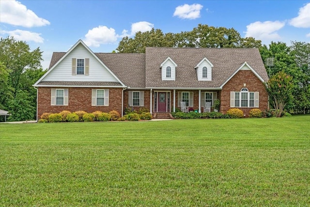 379 Hooper Rd, Winchester, TN 37398 - view of front of home with brick siding, a front yard, and a porch