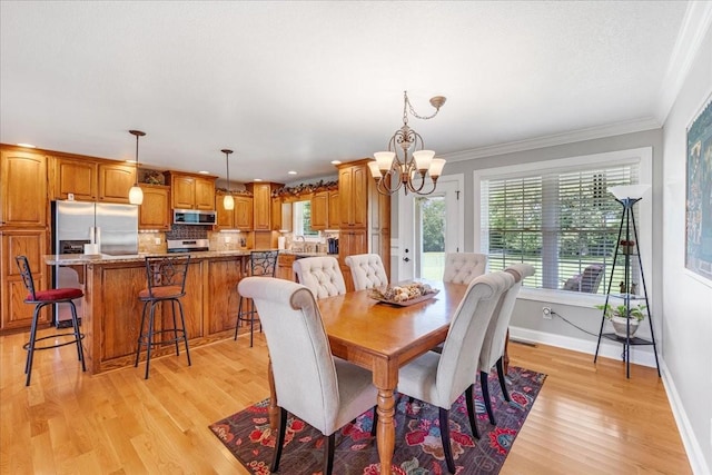 379 Hooper Rd, Winchester, TN 37398 - dining space featuring a chandelier, light wood-style floors, and crown molding