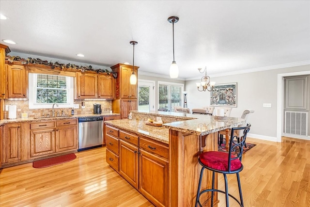 379 Hooper Rd, Winchester, TN 37398 - kitchen featuring dishwasher, a breakfast bar, light wood finished floors, a kitchen island, and crown molding