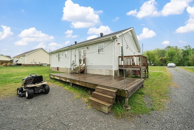 105 Gammons Ln, Lafayette, TN 37083 - back of house with a wooden deck, entry steps, and a lawn