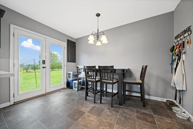 105 Gammons Ln, Lafayette, TN 37083 - dining room with french doors, a chandelier, and dark stone finish flooring