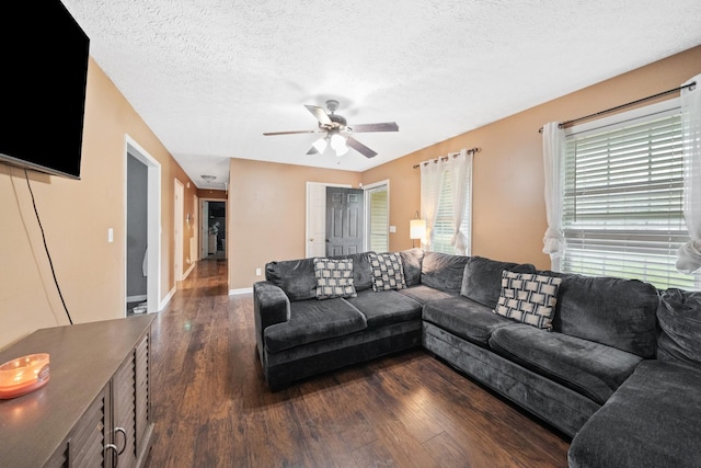 105 Gammons Ln, Lafayette, TN 37083 - living room with dark wood-style flooring, a ceiling fan, and a textured ceiling